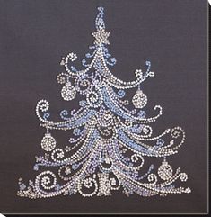 a cross stitch christmas tree with blue and white beads on it's side, in front of a black background