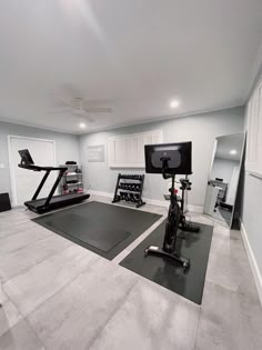 a home gym with treadmills and exercise equipment