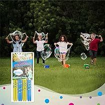 a group of kids playing with bubbles in the grass