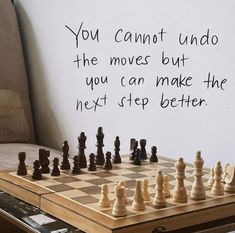 a chess board with a quote written on it