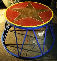 a red and yellow table with a star on it