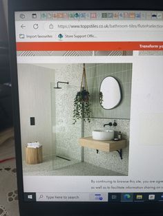 a computer screen showing a bathroom with a sink and mirror on it's side