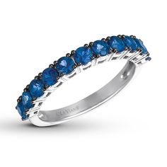 a white gold ring with blue sapphire stones