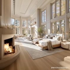 a large living room with lots of windows and a fire place in the middle of it