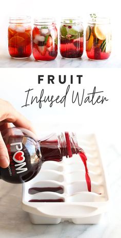 fruit infused water is being poured into mason jars