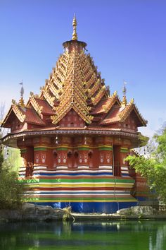 an ornate building sitting next to a body of water