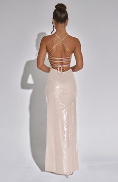 Party season's here, so make the most of it in the showstopping Bells dress. This floor-sweeping maxi is made from our bias cut sparkle fabric which has a beautiful drape and skims over your figure. The dress is completely backless with tie detail straps. 



Colour: Nude.

Premium sparkle bias cut fabric.

Cupped bust.

Low back.

Tie detail.

Thigh high split.

Maxi length.

Model is an XS and is wearing an XS.

 Size: XS, S, M, L, XL, XXL Sparkle Maxi Dress, Low Back Dress Formal, Babyboo Dress, Backless Formal Dress, Sparkly Maxi Dress, Homecoming Dresses Corset, Midi Dress Wedding Guest, Sparkle Fabric, Dresses Flowy