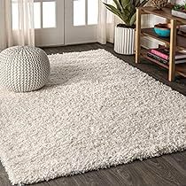 a large white rug in a living room