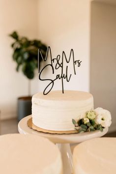 a wedding cake with the word mr and mrs on it