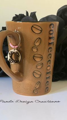 a coffee mug with a ring on the handle