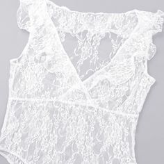 This lace bodysuit is a little bit sweet and a lot of sassy. Featuring a ruffled plunging v-neckline. This sheerness of the bodysuit gives it the right amount of sophisticated sexiness. This bodysuit pairs perfectly with jeans, pants, skirts, shorts and skirts. Made with a blend of nylon, lace and cotton for comfort and style. Summer Lace Bodysuit For Night Out, Lace Bodysuit For Party, Summer V-neck Lace Bodysuit, Sleeveless Lace Bodysuit With Lace Closure, Chic Sleeveless Bodysuit With Lace Closure, Chic Sleeveless Lace Closure Bodysuit, Party Lace Bodysuit With Lace Trim, Summer Party Lace Bodysuit, Fitted Sleeveless Delicate Lace Bodysuit