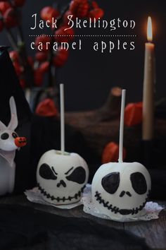 jack skellinggton caramel apples are decorated with white frosting and spooky eyes