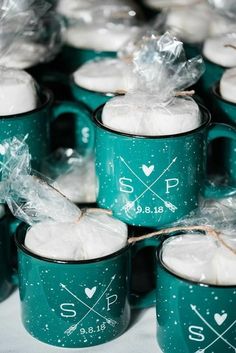 many green mugs with white frosting on them