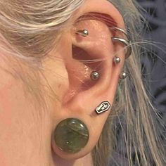 a woman with piercings on her ear