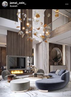 the living room is decorated in marble and features modern furniture, chandelier, and fireplace