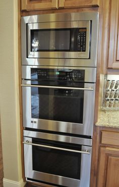 a stainless steel oven and microwave in a kitchen