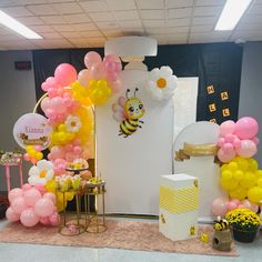 a room decorated with balloons and decorations