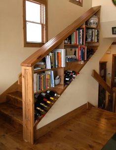 there is a wine rack under the stairs