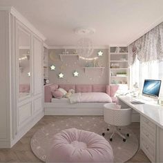 a bedroom with a bed, desk and computer on the table in front of it