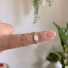 Size 5 White Opal Birthstone Ring In Dainty Style, Dainty White Opal Ring For Everyday, Dainty White Opal Birthstone Ring, Adjustable White Opal Jewelry, Dainty White Oval Opal Ring, Adjustable White Minimalist Opal Ring, White Minimalist Adjustable Opal Ring, White Adjustable Minimalist Opal Ring, Silver Eternity Ring