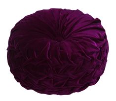 a large purple ball sitting on top of a white floor