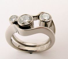 a ring with three diamonds on it