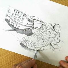 someone is drawing a shoe with a pencil