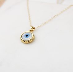 Evil eye necklace, coin necklace, dainty gold necklace, dainty jewelry, layering necklace, evil eye gold coin necklace, gifts for her Gold evil eye charm charm suspended on gold chain The evil eye is known for protection and positive energy D E T A I L S *16mm round Shiny Gold filled evil eye coin pendant *Gold filled cable chain with spring ring closure *Select your perfect length SHIPPING: *Free domestic shipping on all orders PACKAGING: *All pieces come beautifully packaged, perfect for gift Dainty Round Evil Eye Necklace, Dainty Evil Eye Round Pendant Necklace, Orders Packaging, Jewelry Layering Necklace, Gold Necklace Dainty, Jewelry Layering, Necklace Evil Eye, Gold Coin Necklace, Tarnished Jewelry