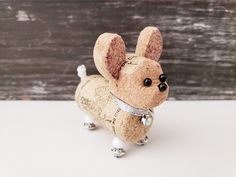 a small toy dog made out of cork