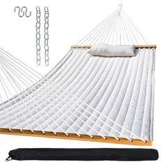 a large white hammock with chains hanging from it's sides and a pillow on the other side