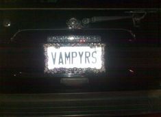 the license plate on this vehicle is decorated with crystal beads and sparkles that spell out, vampyrs