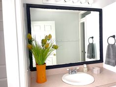 a bathroom with a sink and mirror in it