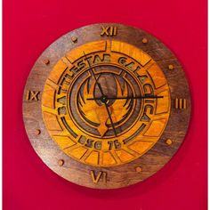 a wooden clock with roman numerals on it