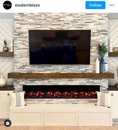 a television mounted above a fireplace in a living room