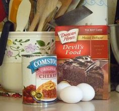 some food is sitting on the counter next to utensils and other kitchen items