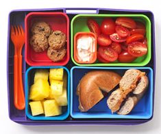 a plastic lunch box filled with different types of food