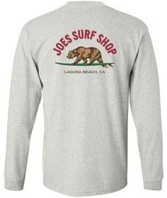 Featuring our Joe's Surf Shop brand logo, this is a must have long sleeve tee. Rep your Laguna Beach wear year round! This graphic long sleeve tee depicts everything California is! Designed in Laguna Beach, CA. Classic Heavyweight 100% Cotton Long Sleeve T-Shirt Printed in the USA Rib knit cuffs Coverseamed neck Double-needle sleeves and hem Free Shipping on US orders 65$+ Heather Grey Long Sleeve T-shirt For Streetwear, Heather Grey Long Sleeve Tops With Logo Print, Heather Grey Long Sleeve Top With Logo Print, Heather Grey Long Sleeve Graphic T-shirt, Tri-blend Long Sleeve T-shirt With Letter Print, Tri-blend Long Sleeve Tops With Letter Print, Heather Grey Long Sleeve T-shirt With Letter Print, Tri-blend Long Sleeve Graphic Tee, Heather Grey Long Sleeve Relaxed Fit T-shirt