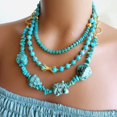 Meet our stunning Turquoise Multi-Strand Necklace, a true statement piece for the stylish and bold! Handcrafted with love, this unique necklace consists of numerous vibrant turquoise beads carefully arranged to create a breathtaking visual effect. The combination of the stunning turquoise hue and the elegant multi-strand design is sure to turn heads and add a touch of bohemian elegance to any outfit. MATERIALS: Our Turquoise MultiStrand Necklace is crafted from high quality turquoise beads, meti Handmade Statement Necklace, Stone Beaded Necklace, Necklace Gemstone, Ceramic Jewelry, Multi Strand Necklace, Quartz Necklace, Strand Necklace, Unique Necklaces, Turquoise Beads