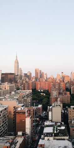 an aerial view of the city with tall buildings