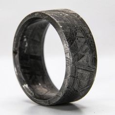 "Each Patrick Adair Designs meteorite ring is handcrafted out of a solid piece of meteorite in an extremely time-consuming process to create a truly unique ring that you would never find in a typical jewelry store. Due to the natural properties of meteorite, each ring will be unique with its own individual patterns. Also, it is possible for the rings to have 1 or 2 naturally occurring small voids or pockets in them; these do not affect the strength or natural beauty of each ring. ■ Ring Details: Meteorite Ring Men, Mens Wedding Bands Unique, Fantasy Ring, Mens Rings Fashion, Meteorite Ring, Mens Engagement, Ring Men, Engagement Rings For Men, Mens Accessories Fashion