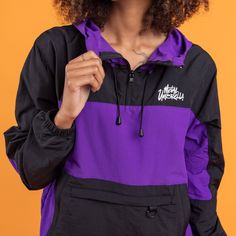 The color of modern royalty. Be kings and queens with this purple windbreaker. Features Versatile hood with elastic drawstrings and adjustable stoppers Woven and rubber tags Metal Umbrella print on the left chest Additional elastic features in the cuffs and adjustable hip drawstring Kangaroo pocket with zips Pockets on both sides Fit Female model is 5'9" and is wearing a size XS Male model is 6'2.5" and is wearing a size S Hooded Windbreaker With Drawstring For Streetwear, Urban Windbreaker With Drawstring For Streetwear, Urban Style Windbreaker With Drawstring For Streetwear, Black Winter Windbreaker With Drawstring, Sporty Black Windbreaker With Drawstring, Purple Outerwear With Adjustable Hood For Streetwear, Purple Outerwear With Drawstring Hood For Streetwear, Purple Adjustable Hood Outerwear For Streetwear, Purple Drawstring Hood Outerwear For Streetwear