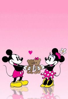 two mickey and minnie mouses holding hands