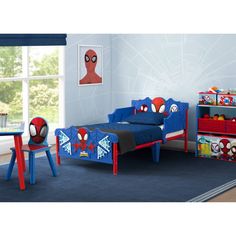 a child's bedroom with spiderman themed furniture