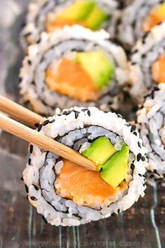 sushi rolls with avocado and sesame seeds