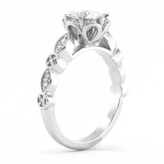 a white gold engagement ring with diamonds on the side