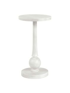 a small white table with a ball on it's top and base in the shape of a pedestal