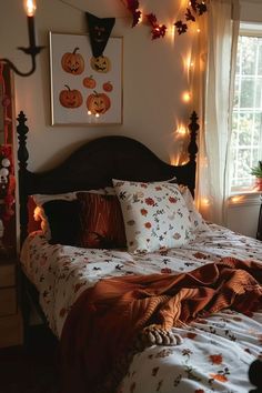 a bedroom decorated for halloween with pumpkins on the wall and lights strung from the ceiling