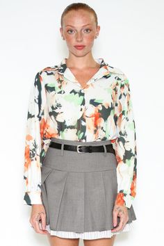 Introducing our Silk Printed Brush Floral Shirt – a classic fit shirt with a delightful twist. This shirt combines timeless elegance with a vibrant floral print featuring shades of orange and green against a crisp white background. This shirt comes with button cuffs, and boasts a loose point collar with collar stand for enhanced breathability and comfort. It's perfect for those looking for both style and comfort. Designed for a relaxed fit Fits true to size, take your normal size Composition: 10 Elegant Multicolor Floral Print Shirt, Green Floral Print Button-up Shirt, Classic Orange Tops For Spring, Orange Floral Print Collared Shirt, Classic Printed Spring Shirt, Classic Floral Print Spring Tops, Orange Collared Shirt With Floral Print, Green Printed Workwear Shirt, Classic Floral Print Tops For Spring