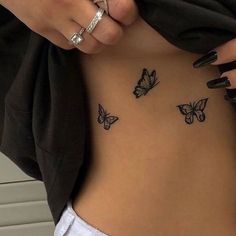 a woman's stomach with butterflies tattooed on her belly and the words, i love you