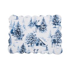 a blue and white placemat with deer in the woods on it's side